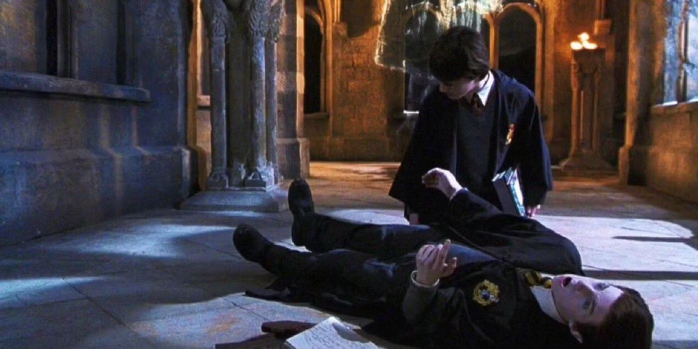 Harry inspects a student who is in suspended animation in Harry Potter and the Chamber of Secrets.