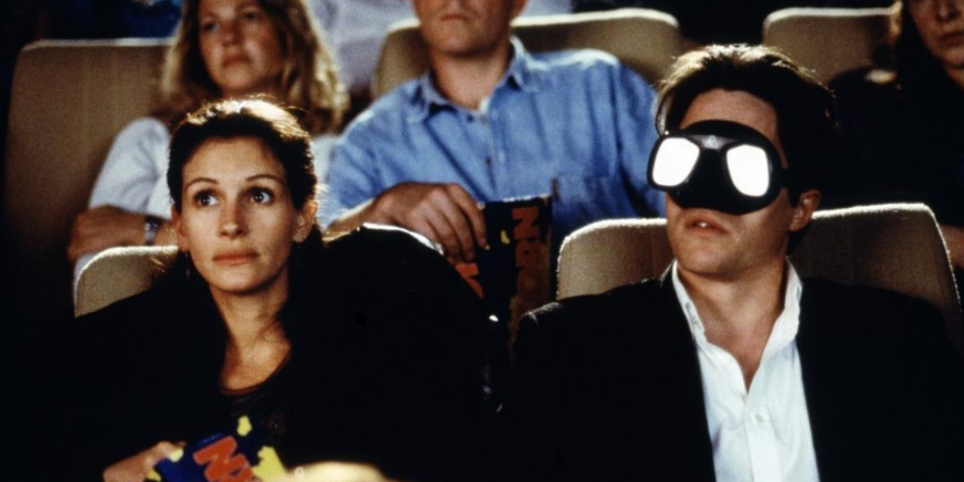 Julia Roberts and scuba-goggle-wearing Hugh Grant watch a movie in a theater in Notting Hill.