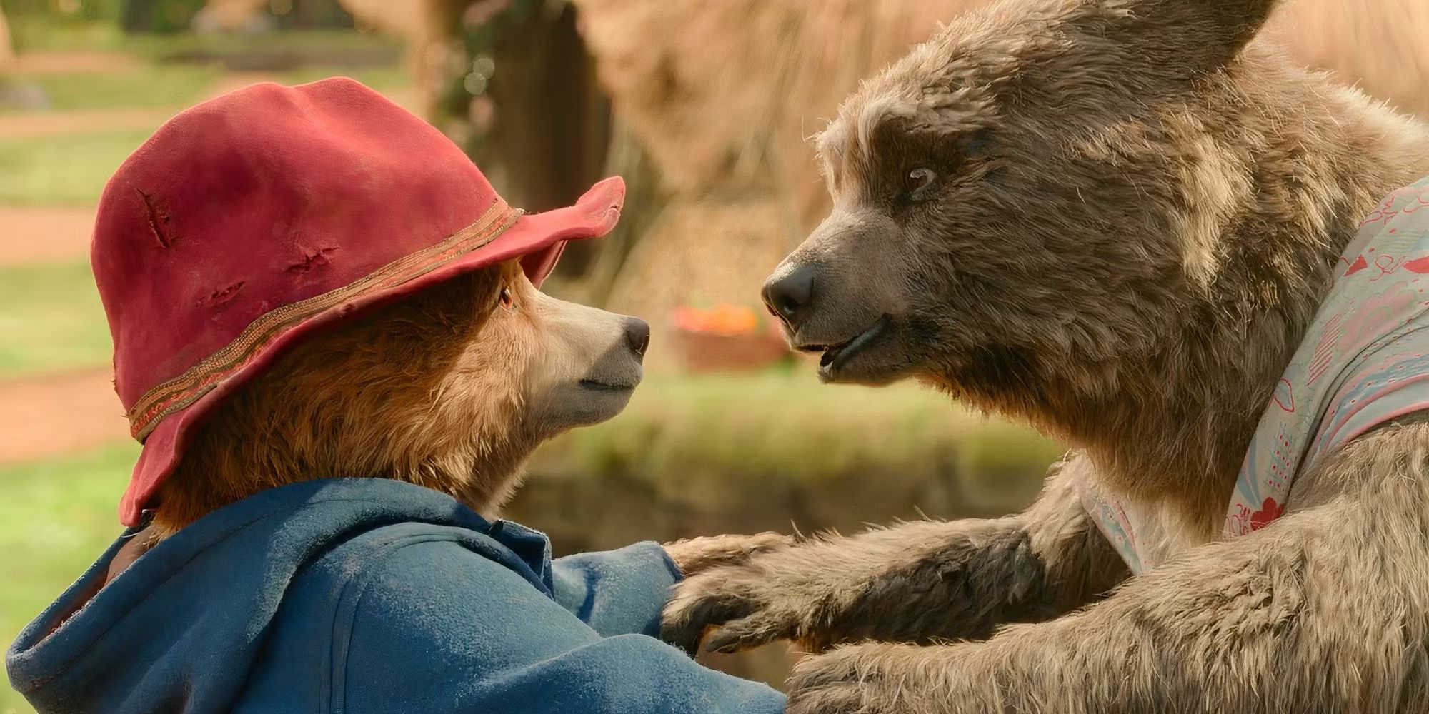 paddington and aunt lucy holding paws in paddington in peru