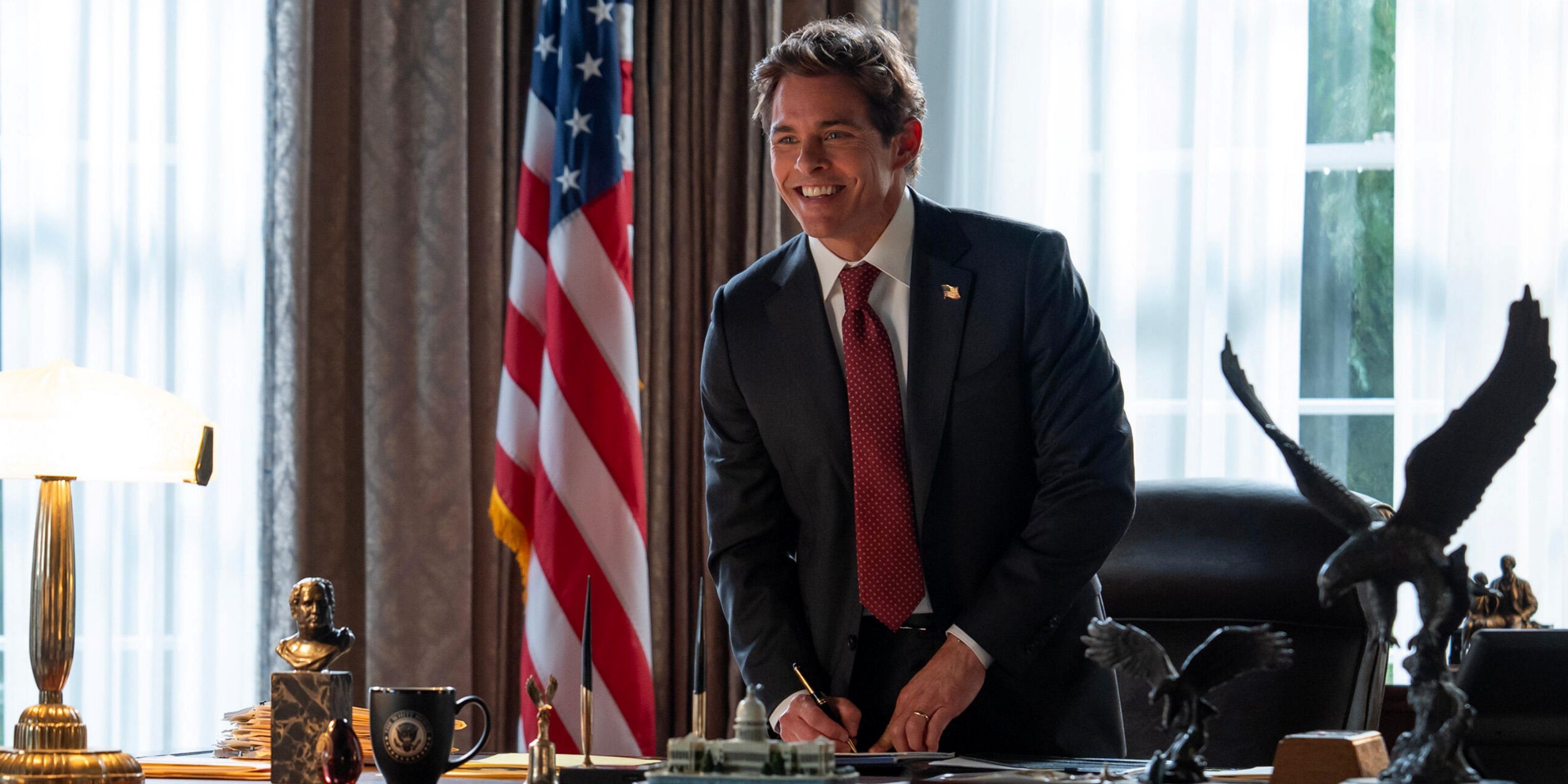 James Marsden as Cal Bradford standing at the president's desk signing a paper in the Hulu series Paradise