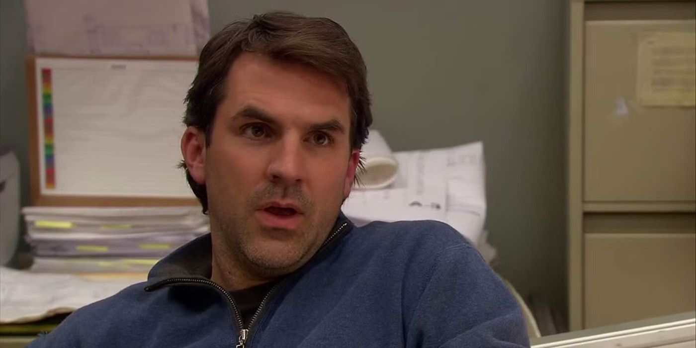 Mark looks at someone off camera in Parks and Recreation