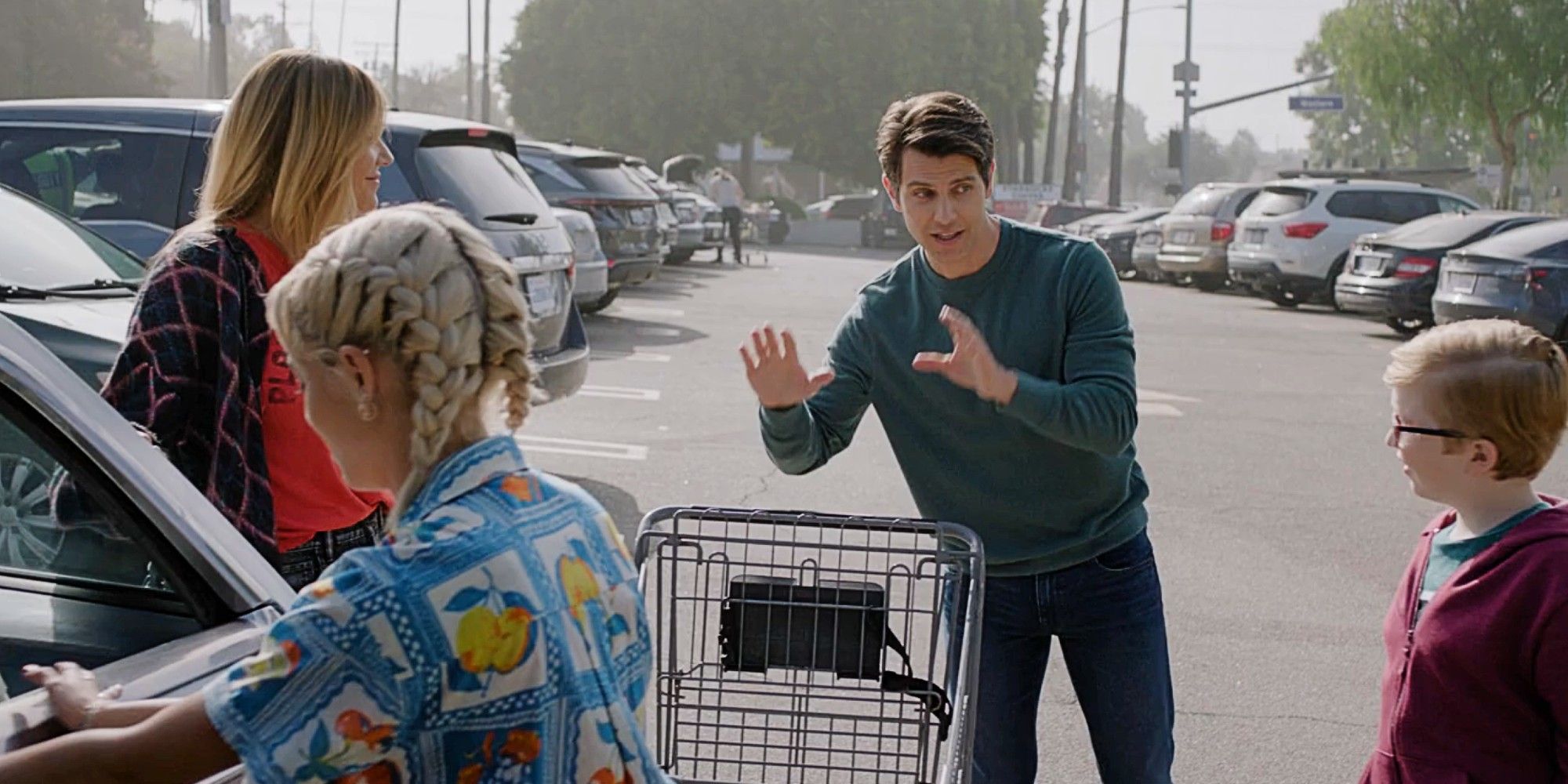 Morgan, Ava and Elliot in a parking lot talking to a man in the High Potential Season 1 finale.