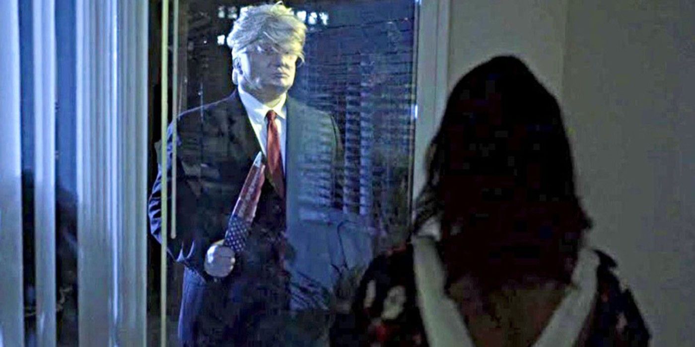 David (Ryan Quinn Adams) holds up a knife outside a window across from Medjine (Amber Boone) in 'President Evil'