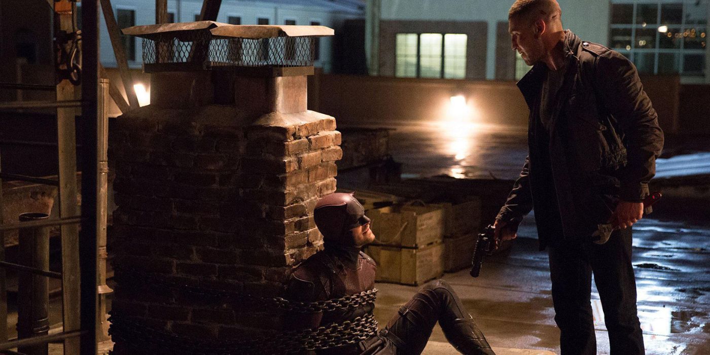 Punisher pointing a gun at chained up Daredevil in Daredevil Season 2, Episode 3.