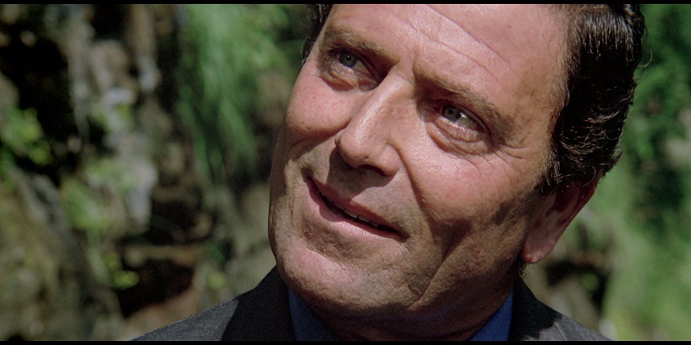 Raf Vallone looking at someone off-camera while smiling