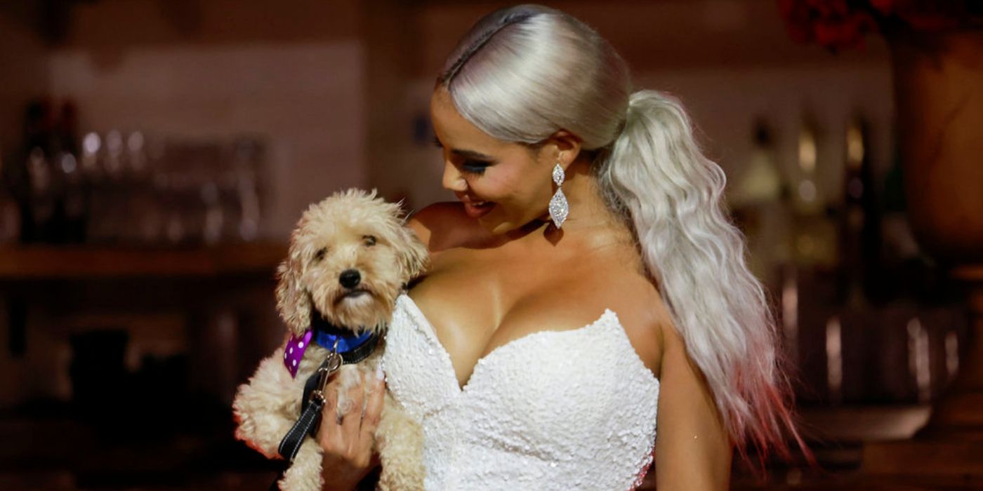 Mia holds a dog on 'The Real Housewives of Potomac.'