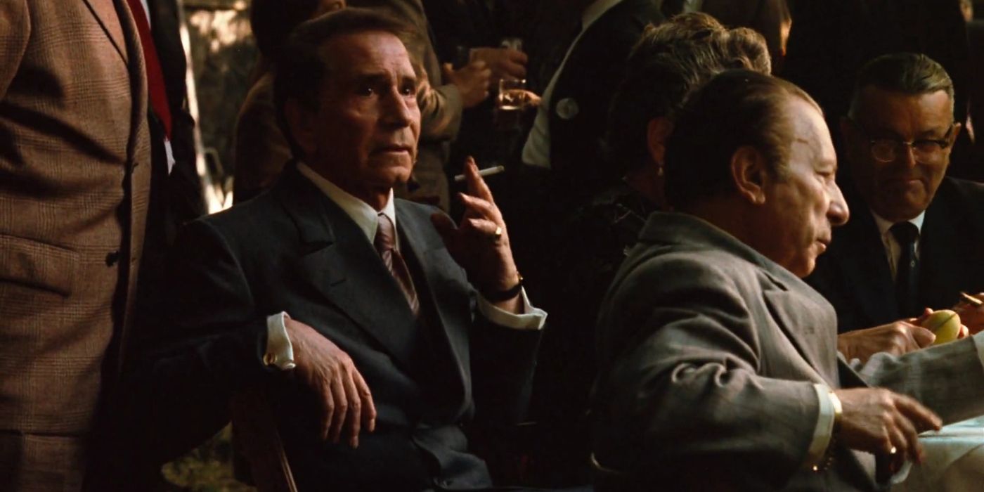 Richard Conte smoking and looking to the distance