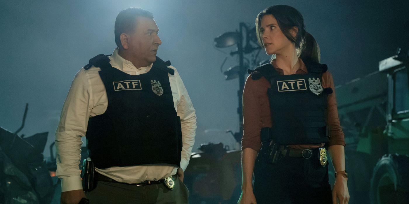 Roberto Montesinos and Sonya Cassiday standing in a scrapyard wearing ATF vests as Guillermo Villanueva and Susan Duffy.