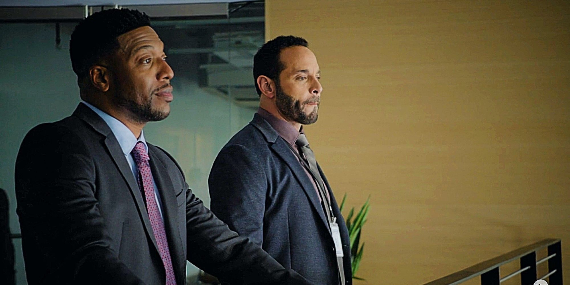 Ronnie Oliver and Adam Karadec standing together and having a conversation in High Potential Season 1 Episode 11