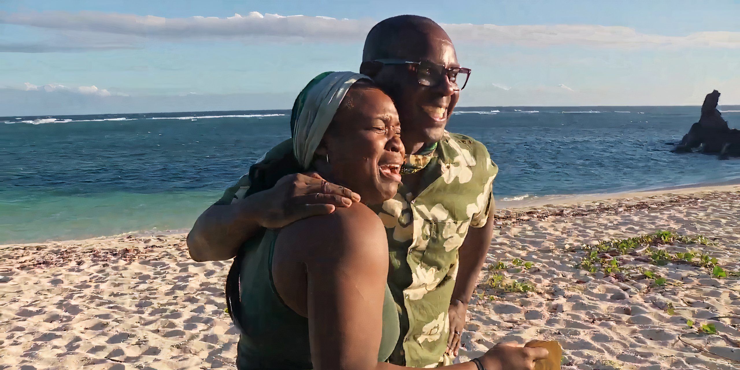 Sai and Cedrek hug on the beach on Survivor 48