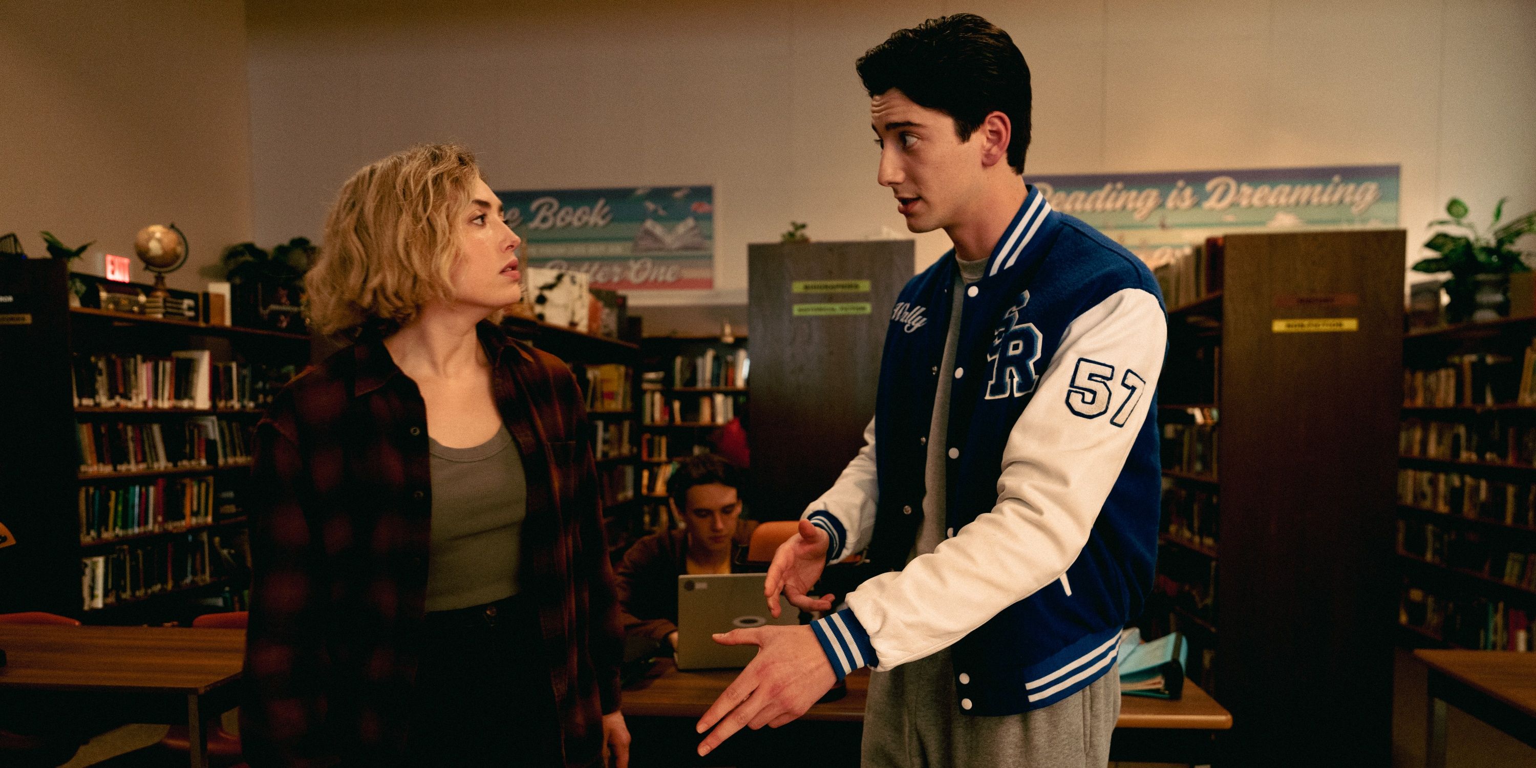 Peyton List as Maddie Nears talking with Milo Manheim as Wally in theol library in Season 2 of School Spirits