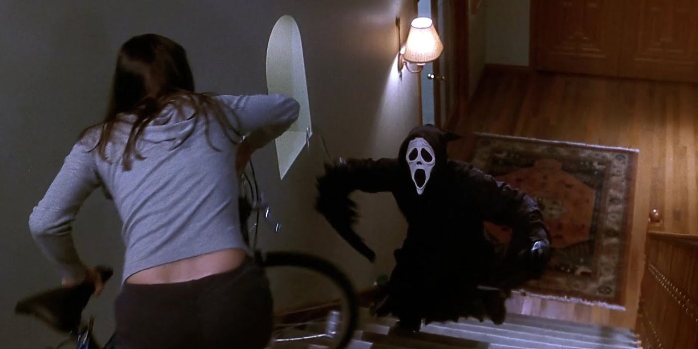 Ghostface chasing Sidney upstairs in &lsquo;Scream&rsquo;.