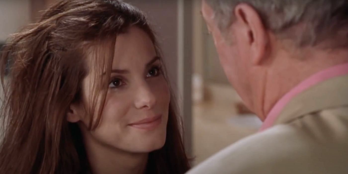 FBI agent Gracie Hart (Sandra Bullock) smiles at her pageant coach and friend Victor Melling (Michael Caine) in Miss Congeniality (2000).