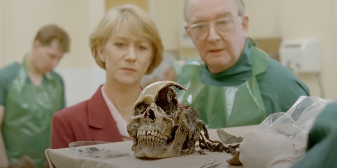 DCI Jane Tennison (Helen Mirren) looks at the skull of a victim in the crime show Prime Suspect.