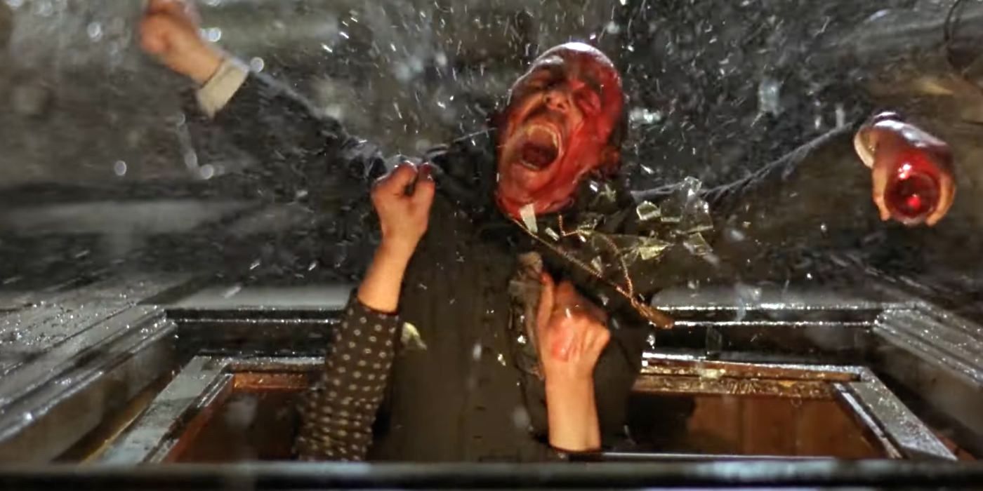 Father Ángel (Álex Angulo) is almost thrown out of a window in the horror comedy The Day of the Beast (1995).