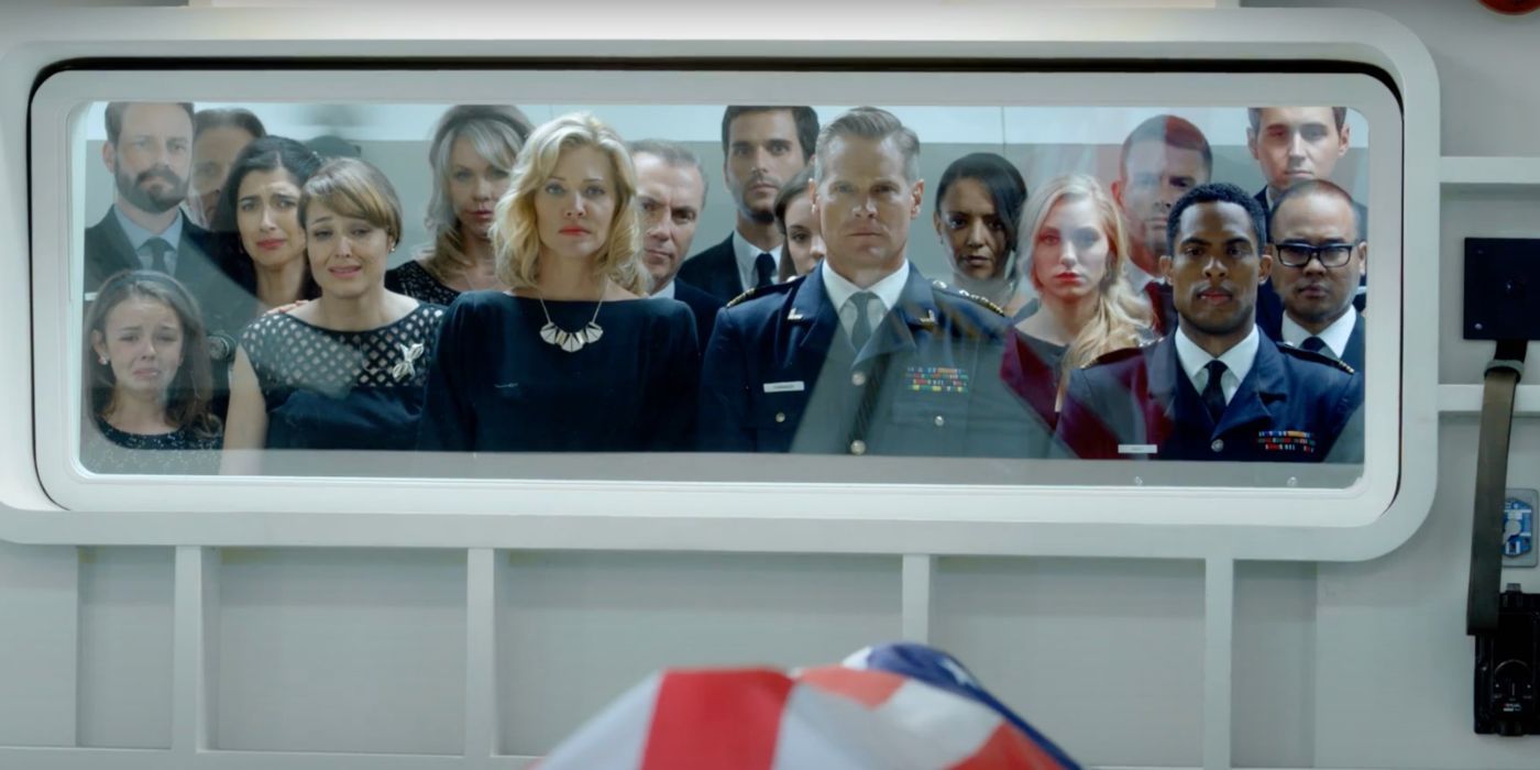 The crew of a spaceship watch a body being sent into space in the Syfy Channel miniseries Ascension.