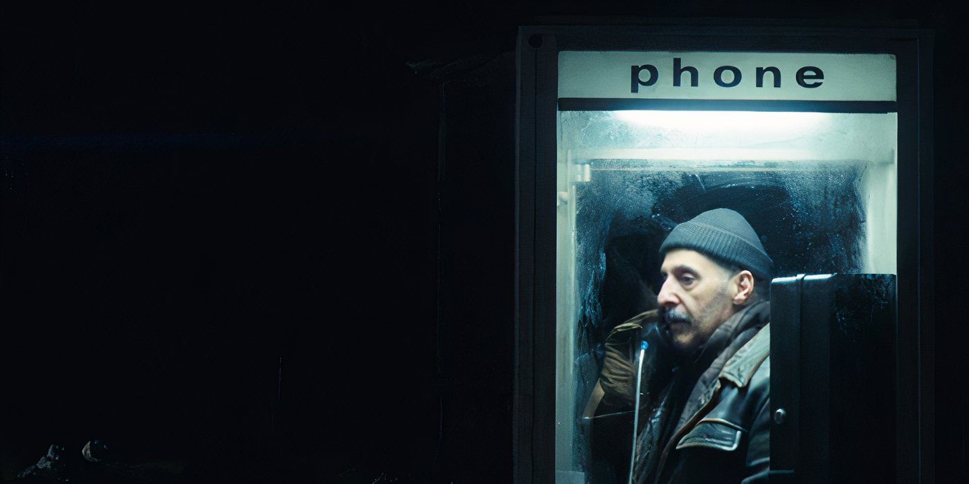 Irving B.&rsquo;s outie (John Turturro) makes a phone call in a telephone booth late at night in Apple TV&rsquo;s Severance.