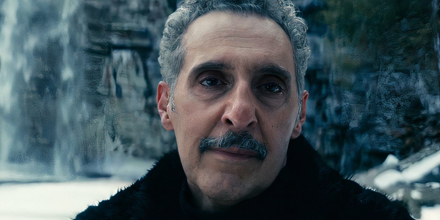Irving B. (John Turturro) stands in front of the Woe&rsquo;s Hollow waterfall, seemingly at peace in Severance on Apple TV+.
