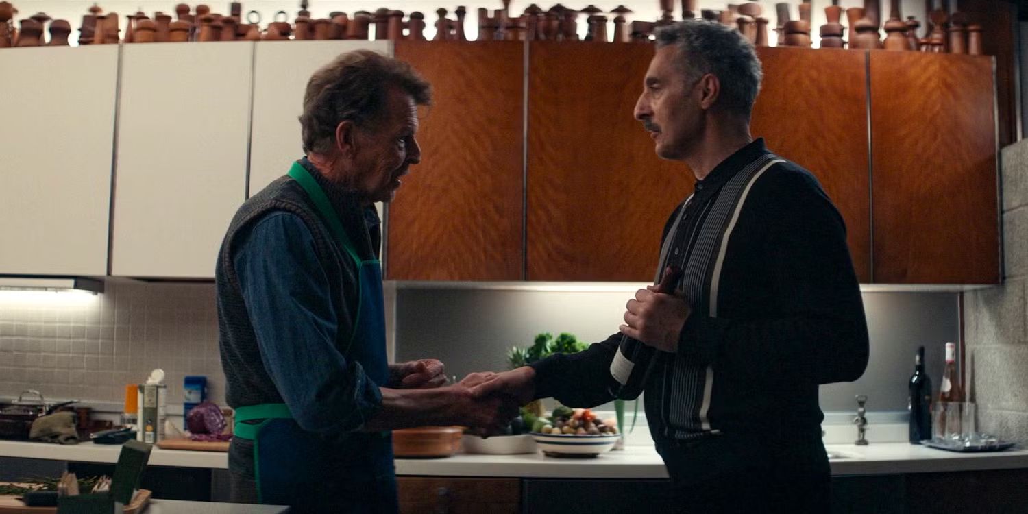 Irving (John Turturro) and Fields (John Noble) shake hands in &lsquo;Severance&rsquo;.