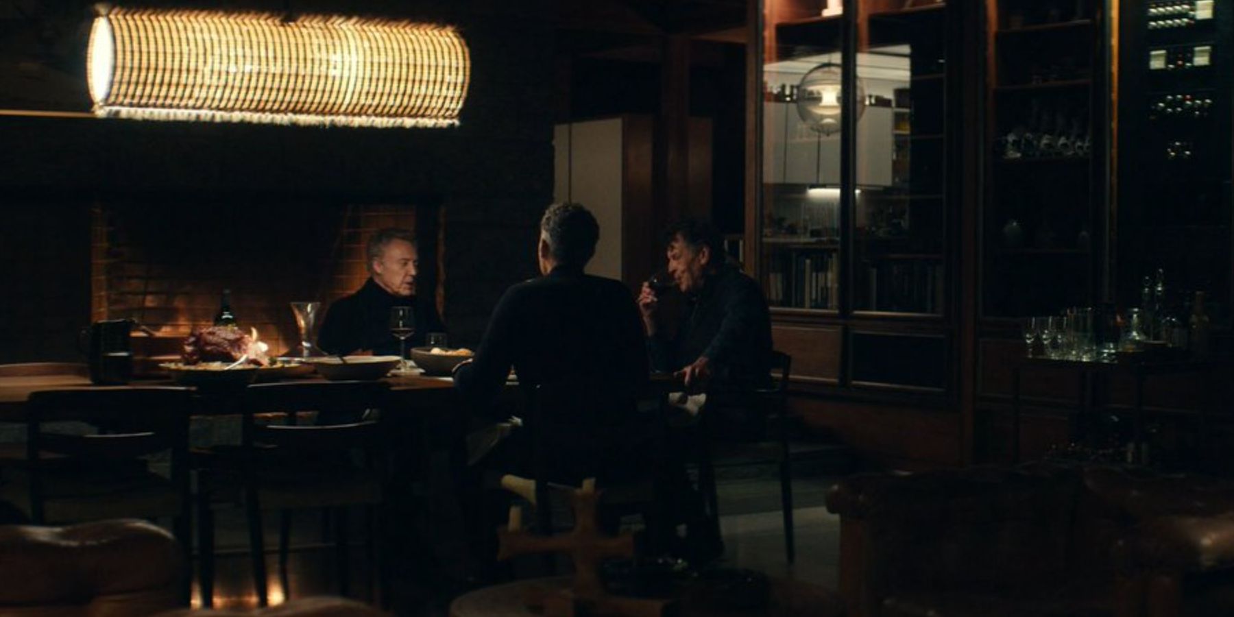 Irving (John Turturro), Burt (Christopher Walken), and Fields (John Noble) sit at a table in &lsquo;Severance&rsquo;.