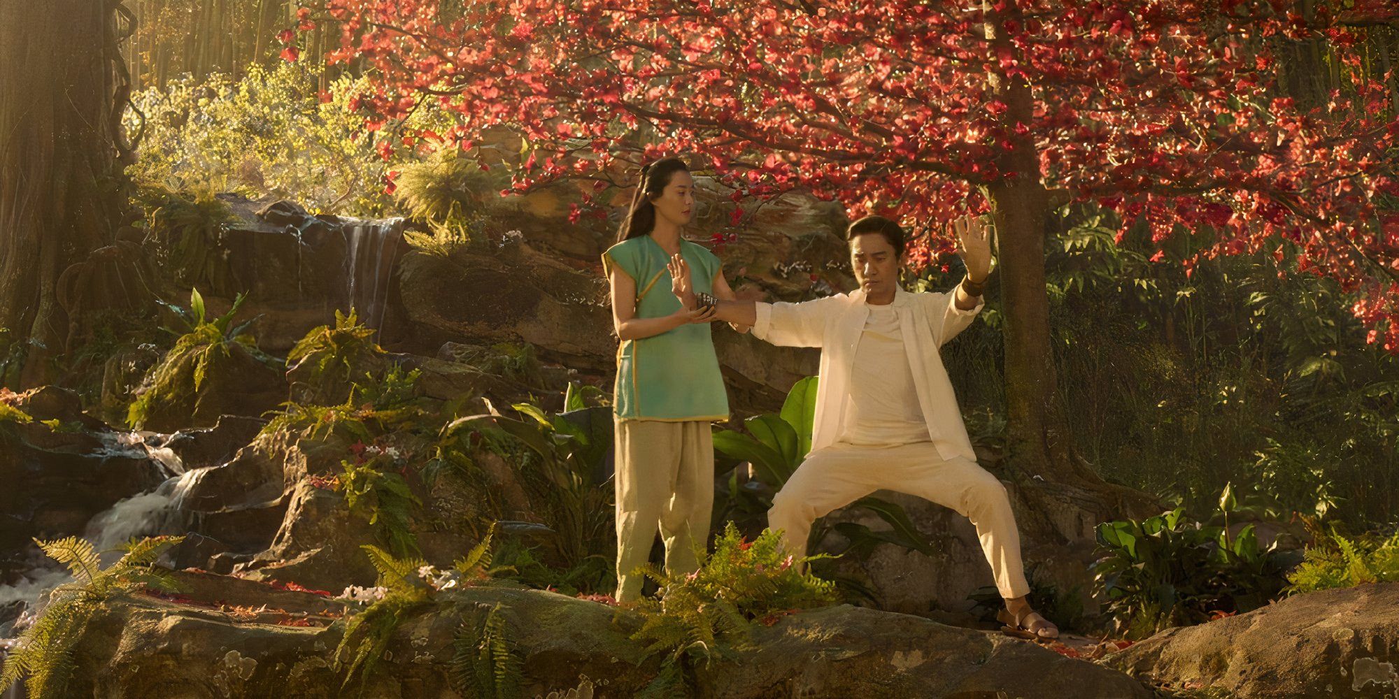 Two characters in a beautiful forest in Shang-Chi and the Legend of the Ten Rings