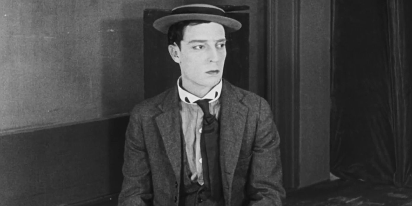 Buster Keaton's projectionist character looks to his left in 'Sherlock Jr.'