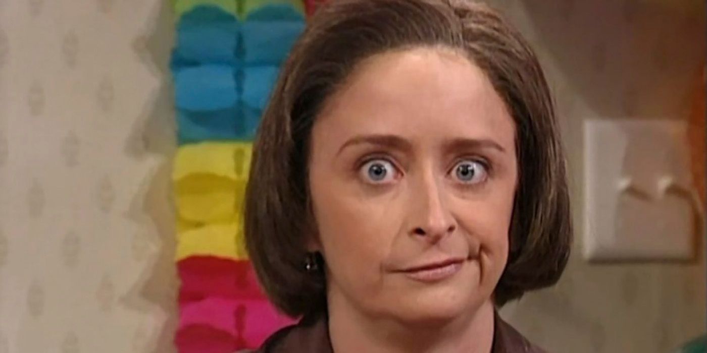 A close-up of Rachel Dratch as Debbie Downer smiling with her mouth off to the side on SNL.