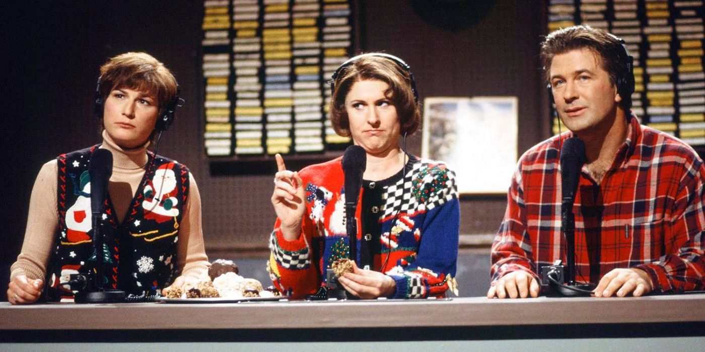 Ana Gasteyer, Molly Shannon, and Alec Baldwin sit in a row with headphones on in Delicious Dish on SNL.