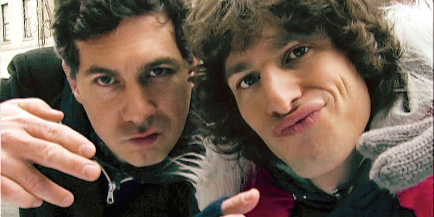 A close up of Chris Parnell and Andy Samberg making facing right up to the camera lens in the Lazy Sunday Digital Short on SNL.