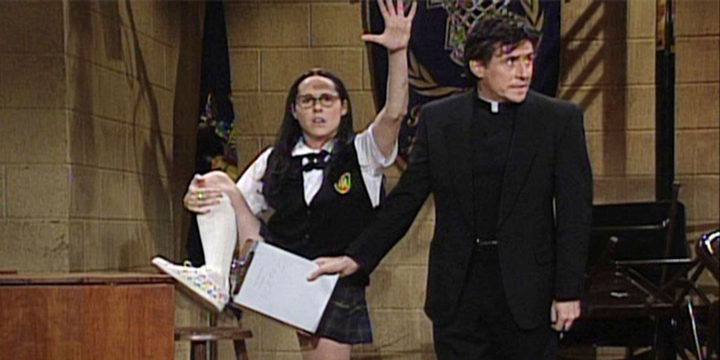 Mary Catherine Gallagher on stage lifting her leg up, a priest holding a paper over her crotch area on SNL.