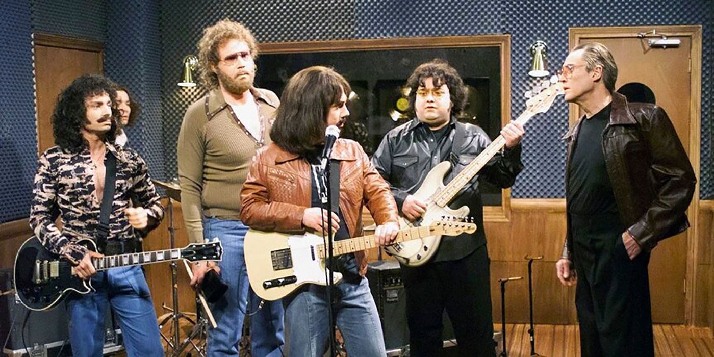 A band of four men plays as Christopher Walken looks on in SNL