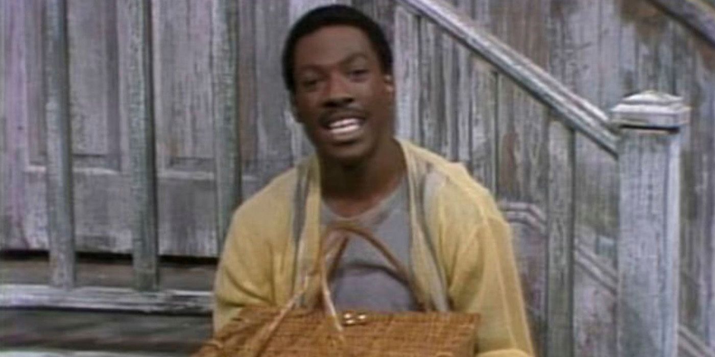 Eddie Murphy sitting on the stoop holding a basket as Mr. Robinson on SNL