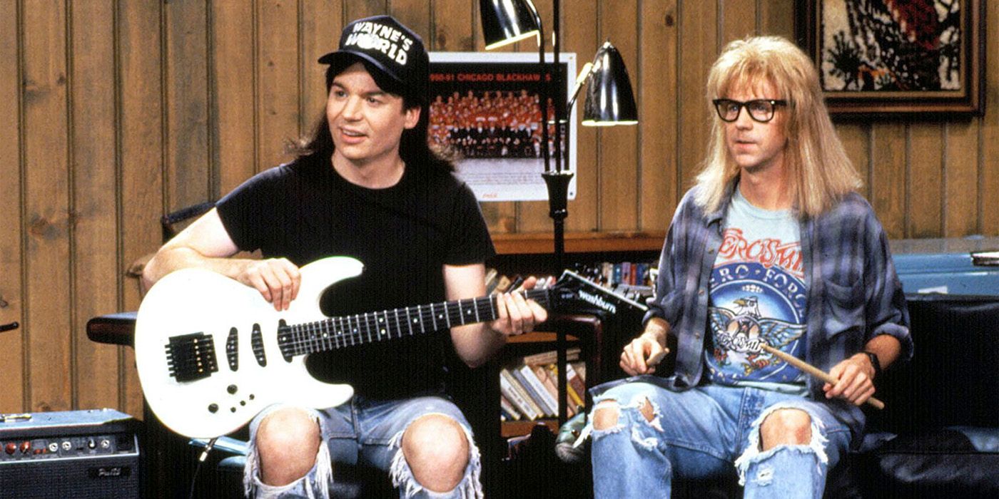 Wayne with his guitar, Garth holding drumsticks in Wayne's World on SNL.