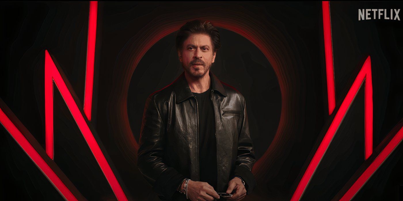 Shah Rukh Khan stands on set delivering lines for a new Netflix series promo