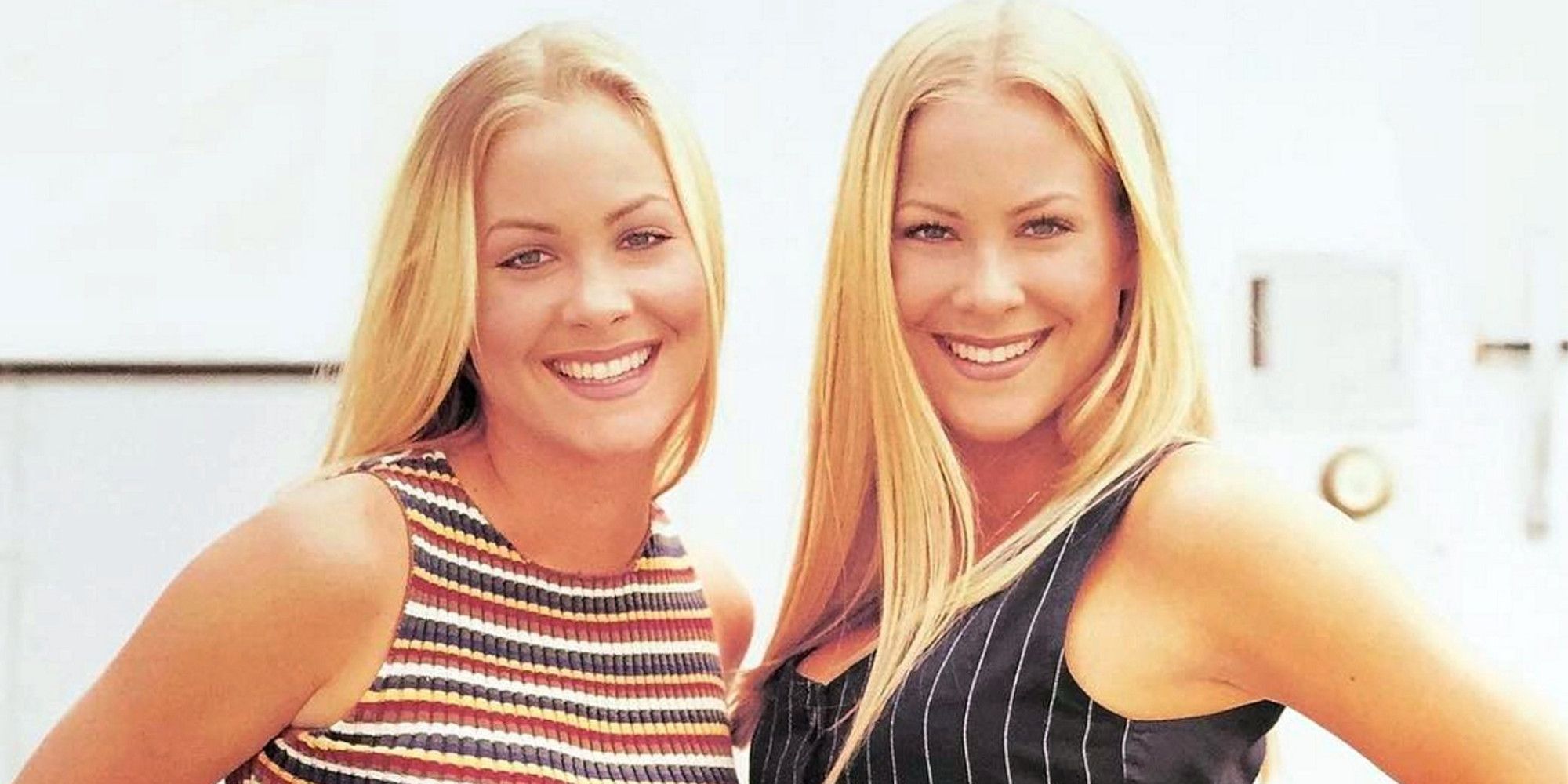 The twins from Sweet Valley High standing together and smiling.
