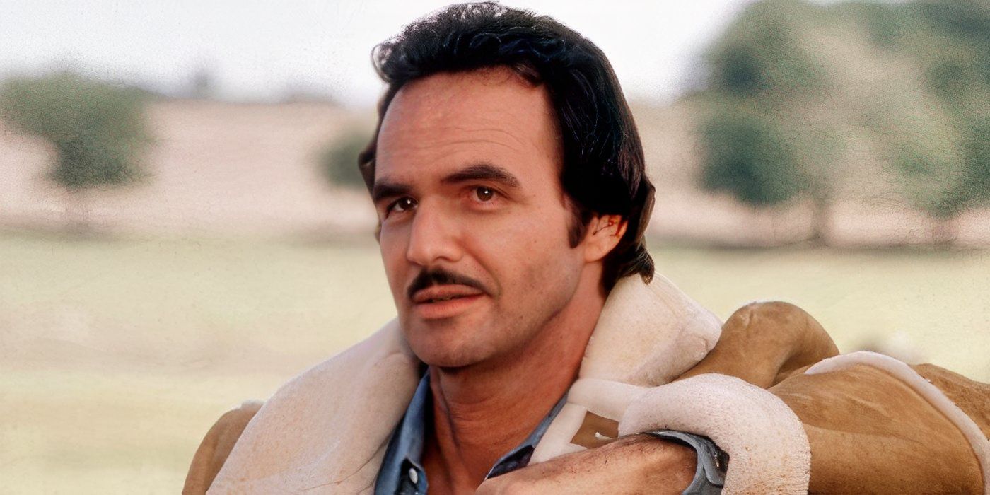Burt Ryenolds smiling softly in The Best Little Whorehouse in Texas