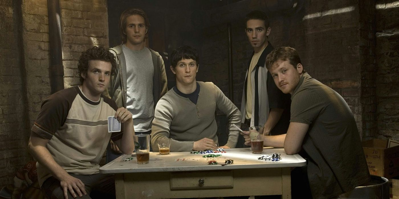Five male siblings sit around a table playing cards in The Black Donnelly&rsquo;s.
