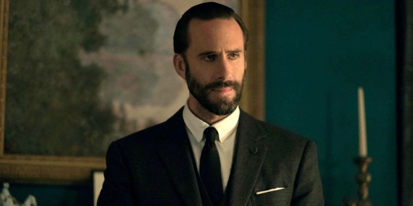 Joseph Fiennes as Fred Waterford wearing a suit in The Handmaid's Tale.