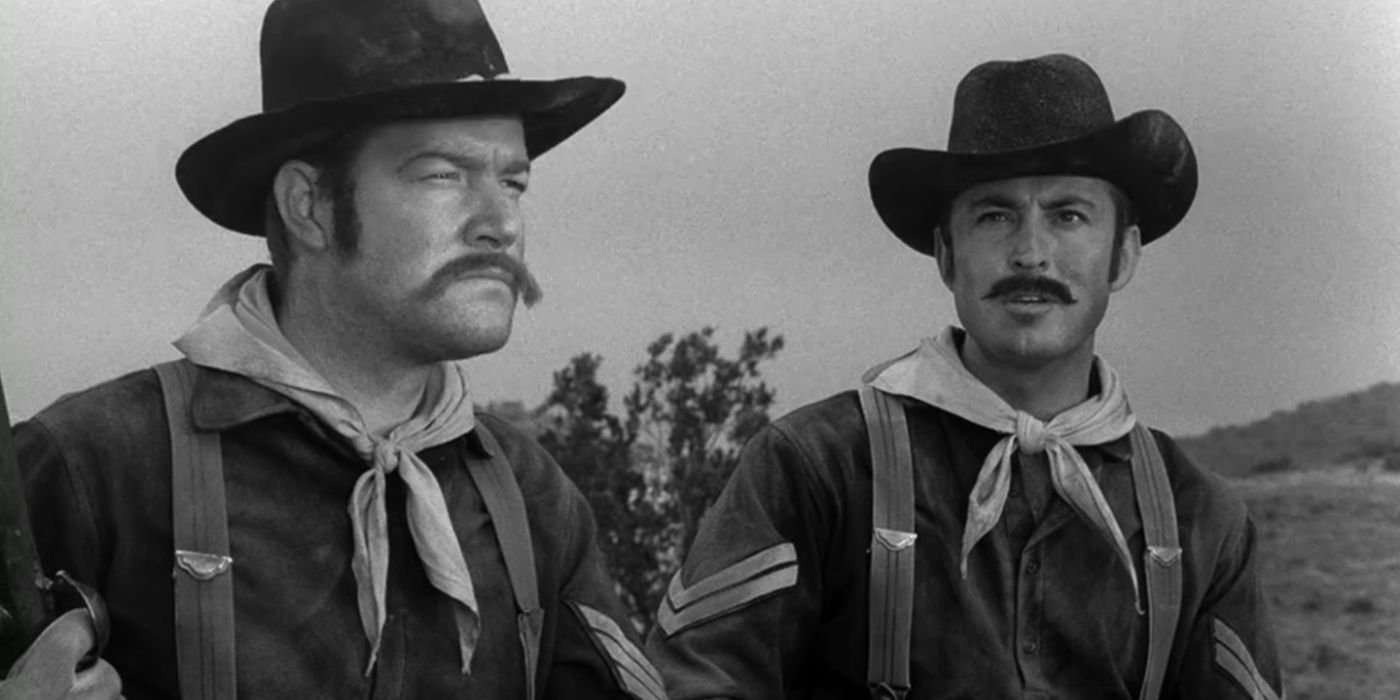 Two men dressed in Civil War uniforms are talking about something while riding horses in The Twilight Zone.