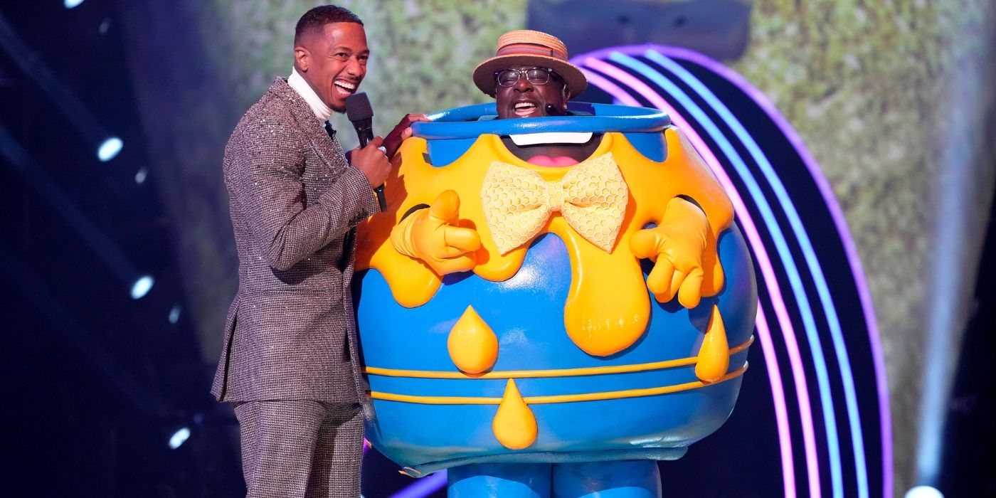 Nick Cannon stands with Cedric the Entertainer after he is revealed to be Honey Pot on &lsquo;The Masked Singer&rsquo; Season 13.