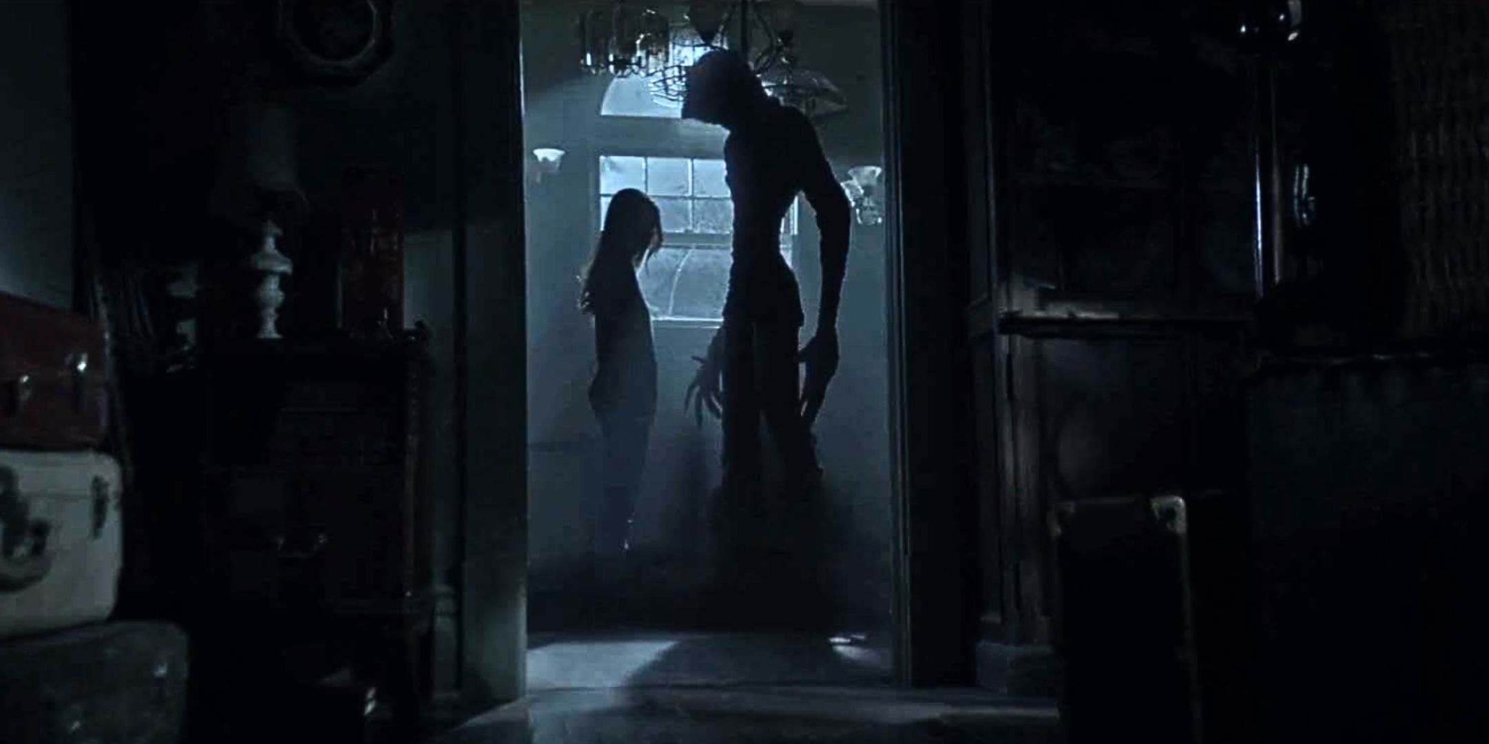 Silhouettes of the midnight man and Alex in a dark corridor in The Midnight Man.