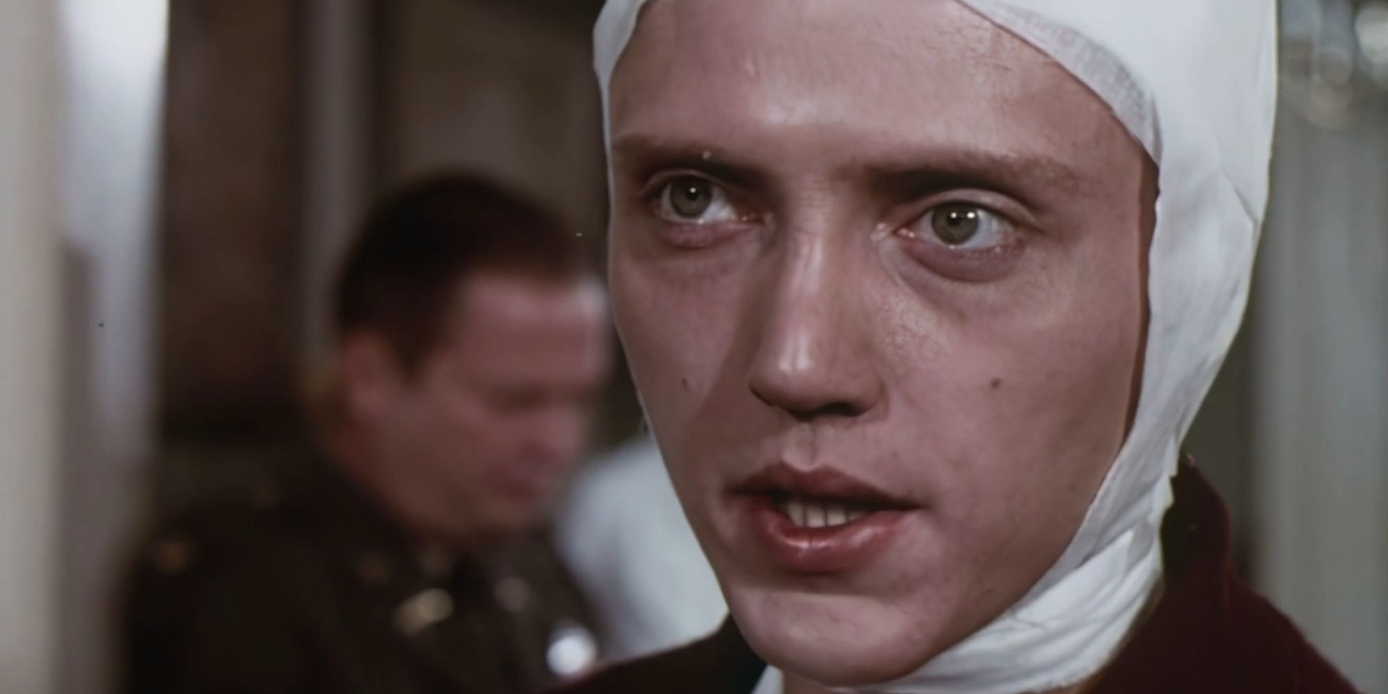Pvt. Reese (Christopher Walken) with his head and neck wrapped in bandages in The Mind Snatchers