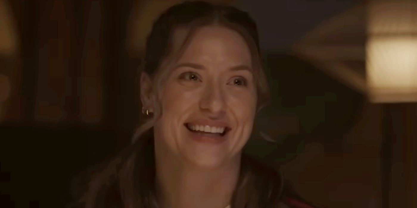 Danica Dreyer as Annie Wilkes smiling at someone off-camera in The Monkey.