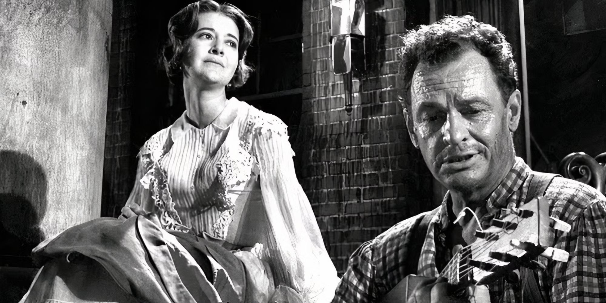 Joanne Linville sits on a front porch with James Gregory nearby playing a guitar in The Twilight Zone.