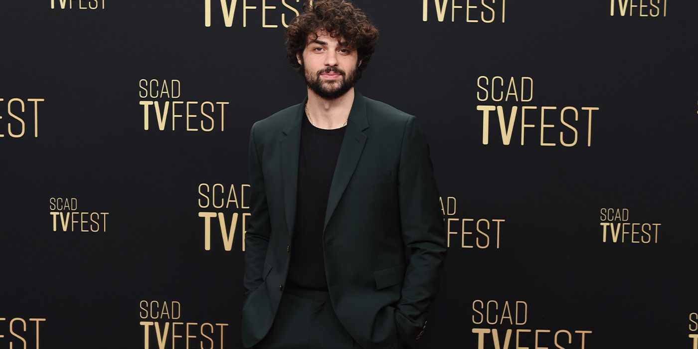 Noah Centineo posing at the 2025 SCAD TVFest for The Recruit