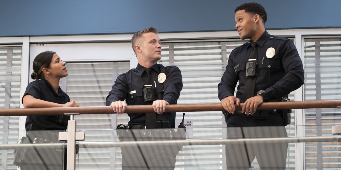 Celina, Seth and Miles standing upstairs, in police uniforms, in the precinct in &lsquo;The Rookie&rsquo;
