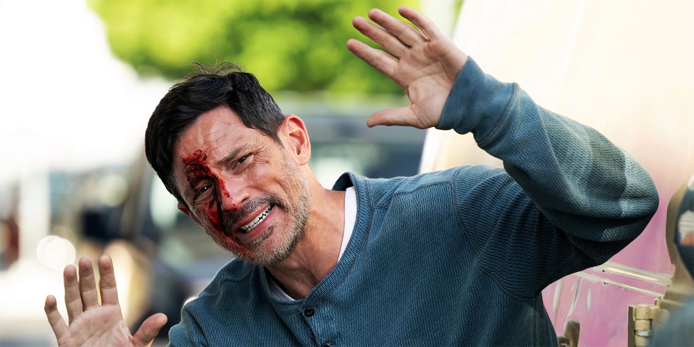 Steve Kazee as Jason Wyler with his hands up and blood on his face in The Rookie