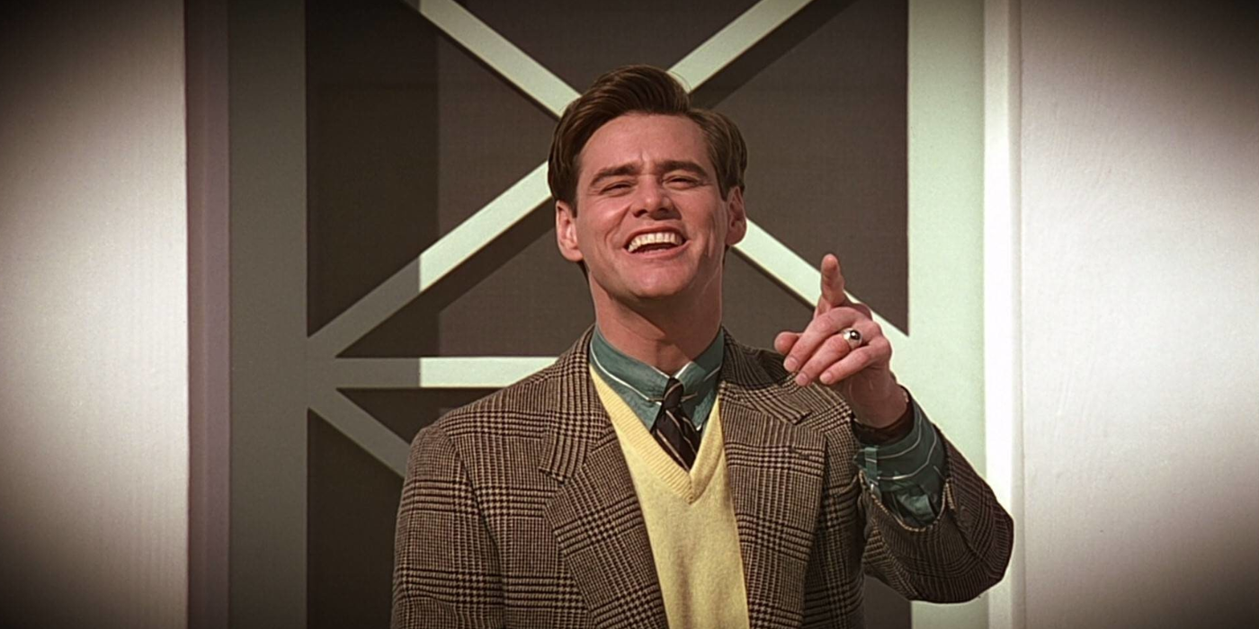 jim carrey smiles and points at the camera