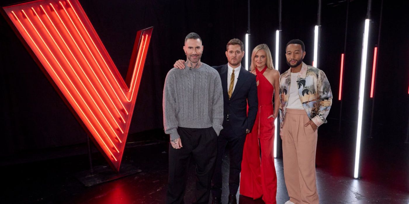 The Season 27 coaches stand next to 'The Voice' logo.