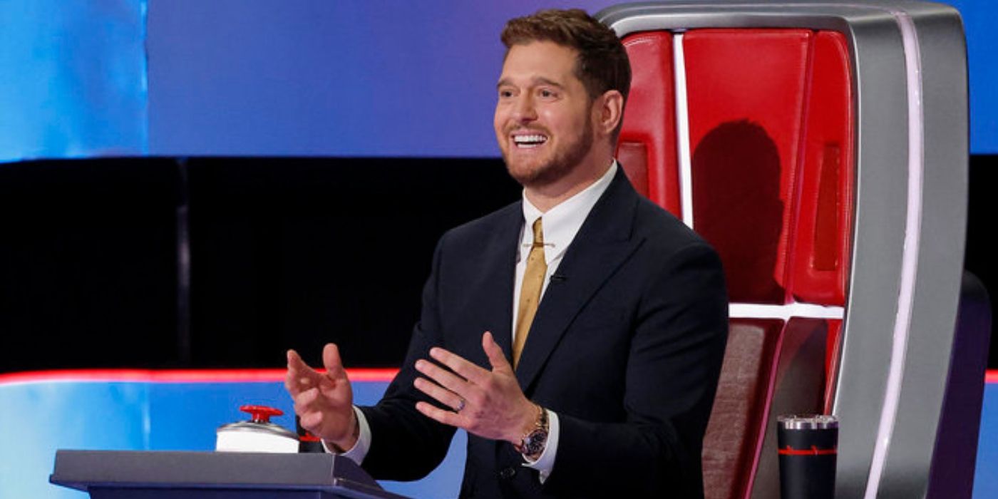 Michael Bublé smiles in his chair on 'The Voice' Season 27.